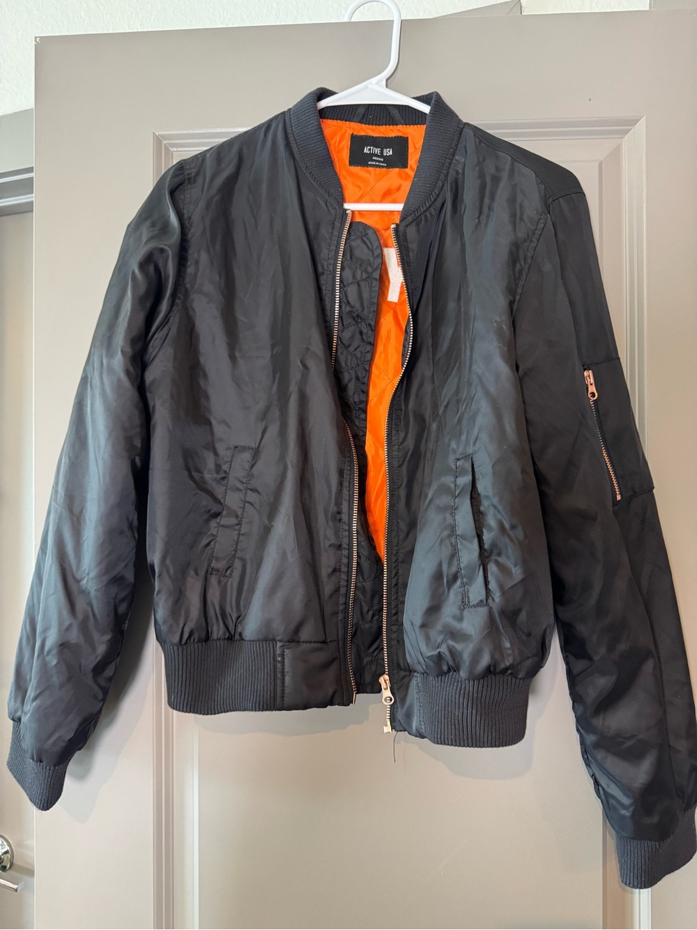 Active USA Black Jacket with Bright Orange Lining with words Boy Bye on the back